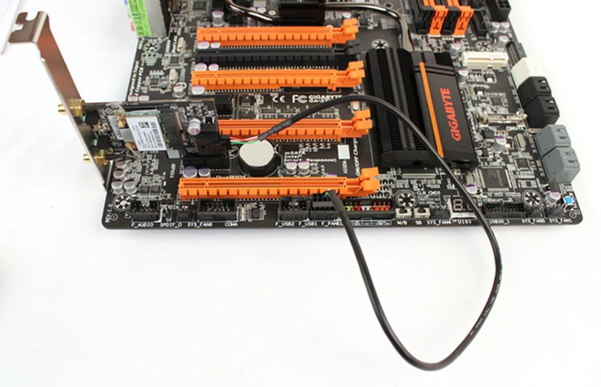 The Wi-Fi/Bluetooth card and its USB cable attached.