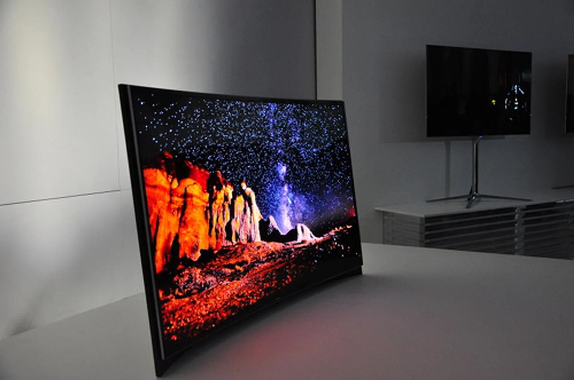 At CES, Samsung also showed off a curved OLED TV display. Content shot on wide-angle would produce an immersive panorama effect that's otherwise not prominent on a flat-planel TV.