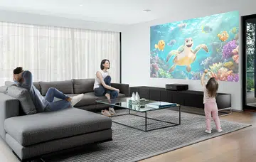 Modern living room with a fireplace and large windows.