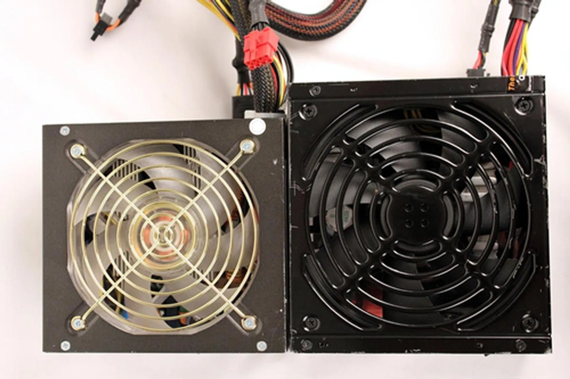 The smaller PSU, on the left, is the one we could get to fit into the Midnight Prodigy. Our regular PSU, with its 160mm depth, just couldn't fit into the chassis.