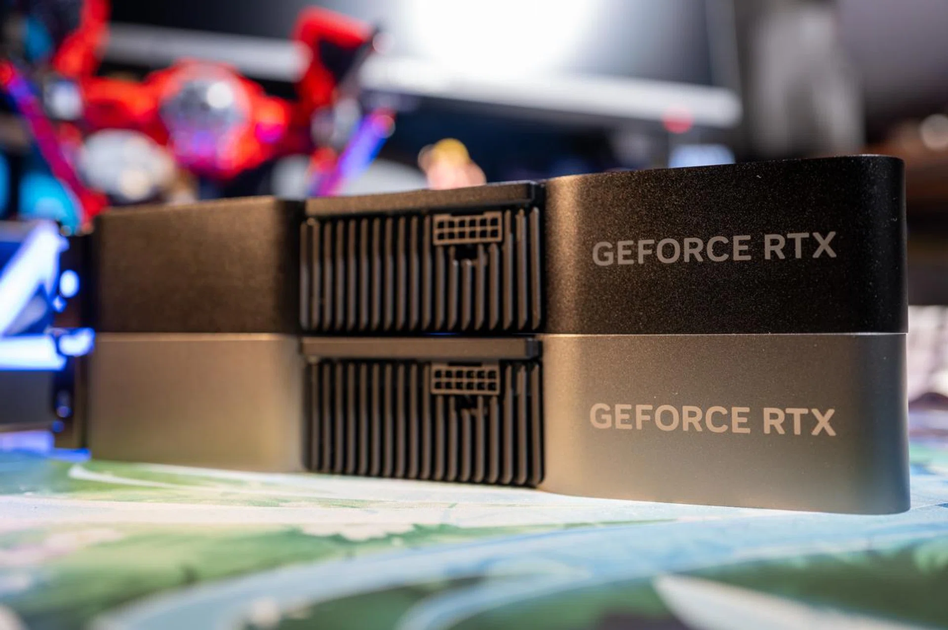 The GeForce RTX 4070 Super (top) is almost indistinguishable from its RTX 4070 predecessor, apart from its darker colour.