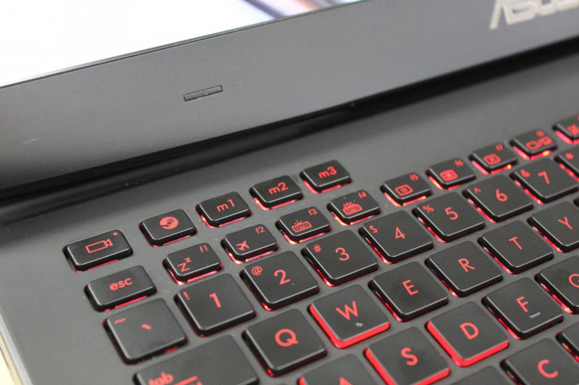 The Steam button's located on the upper left side of the keyboard, right above the ESC button.