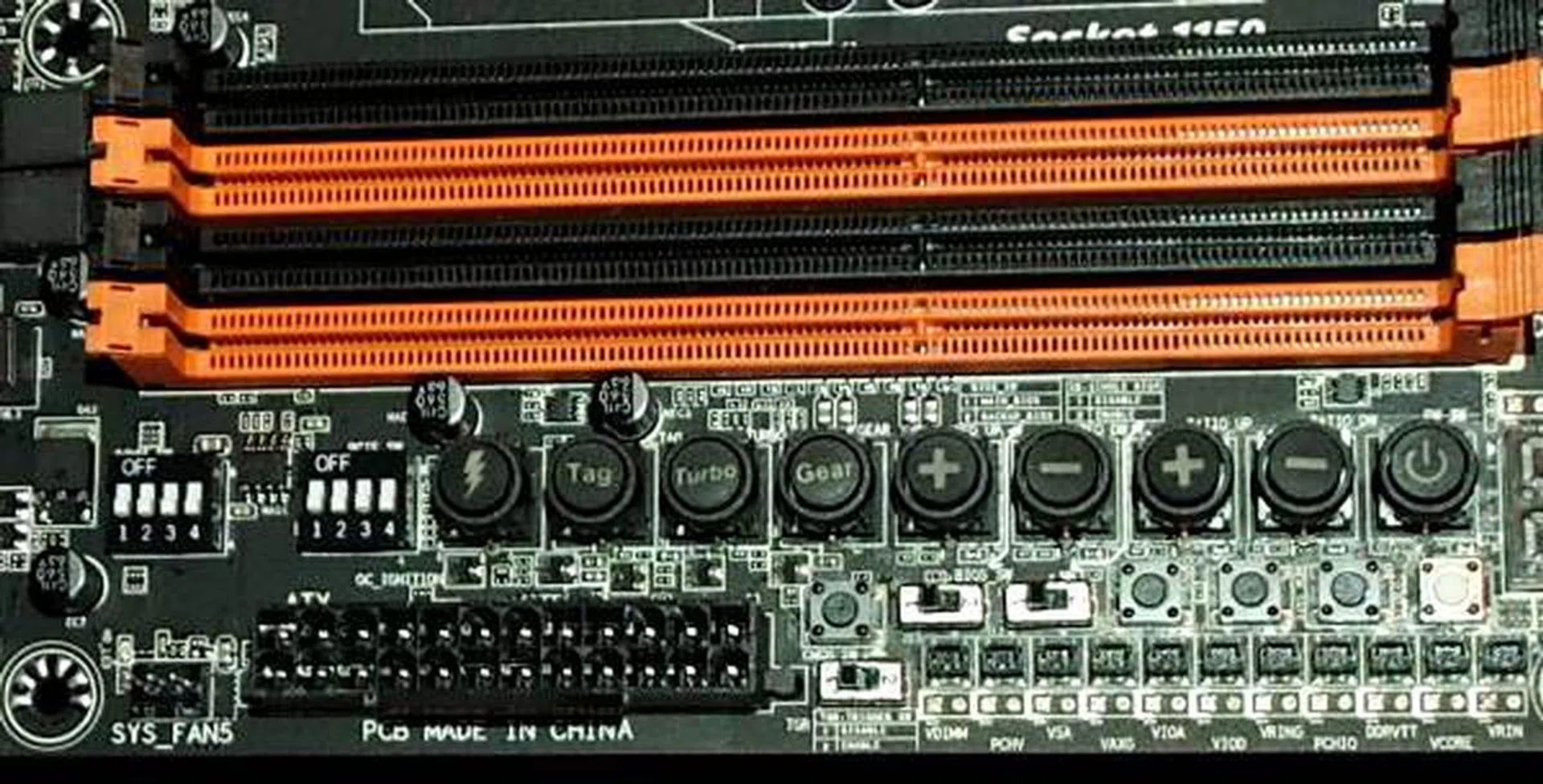Just below the DIMM slots, you'll notice two rows of buttons and switches for instant tweaking and diagnostics. This is a characteristic of the Gigabyte SOC motherboard.