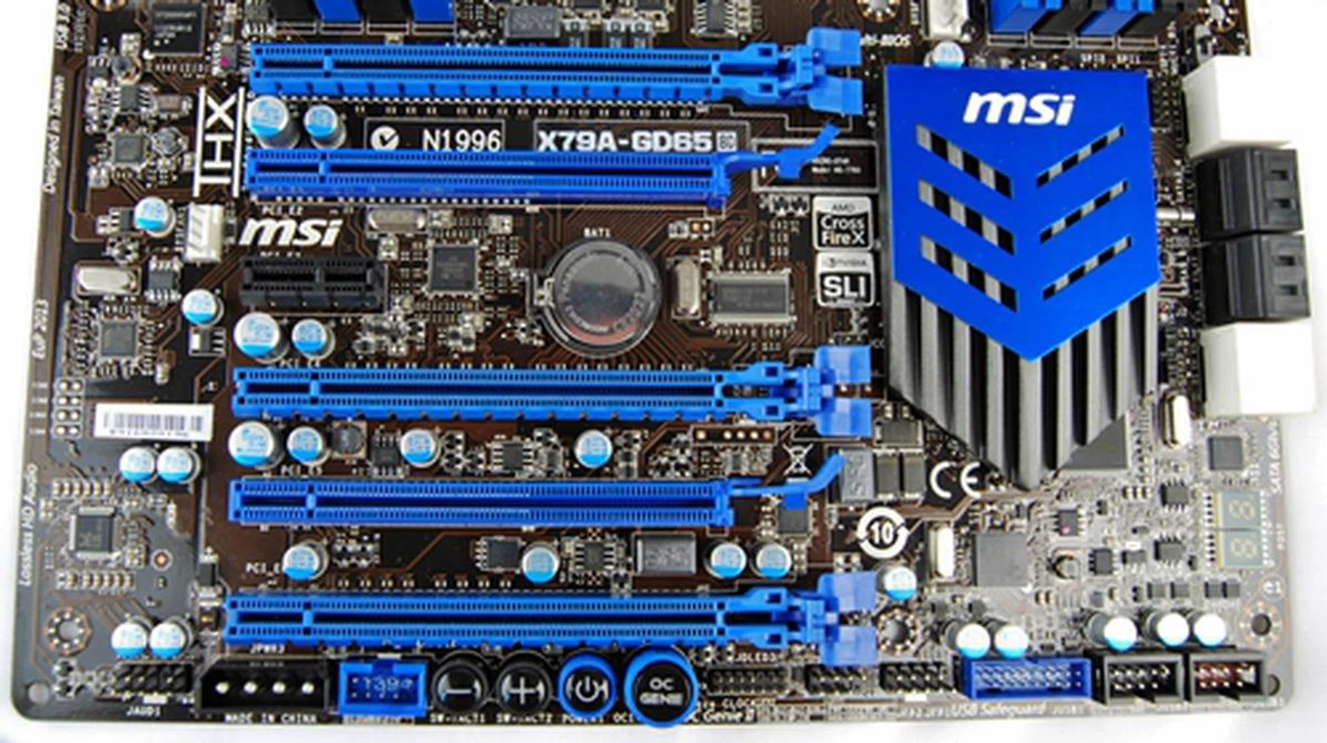 The board sports three PCIe Gen3 PEG slots (easily seen by their huge latches), a single PCIe 2.0 x1 slot and dual PCIe 2.0 PEG slots, which oddly only run at PCIe 2.0 x1 speeds. Since the board's manual only talks about 3-way SLI and CrossFire support, we don't really see the point of having extra PCIe graphics card slots unless the intended user needs to plug in more cards to expand his/her screen real estate. Of the three PCIe 3,0 x16 slots, two of them run at x16 speeds and the last runs at x8 speeds.
