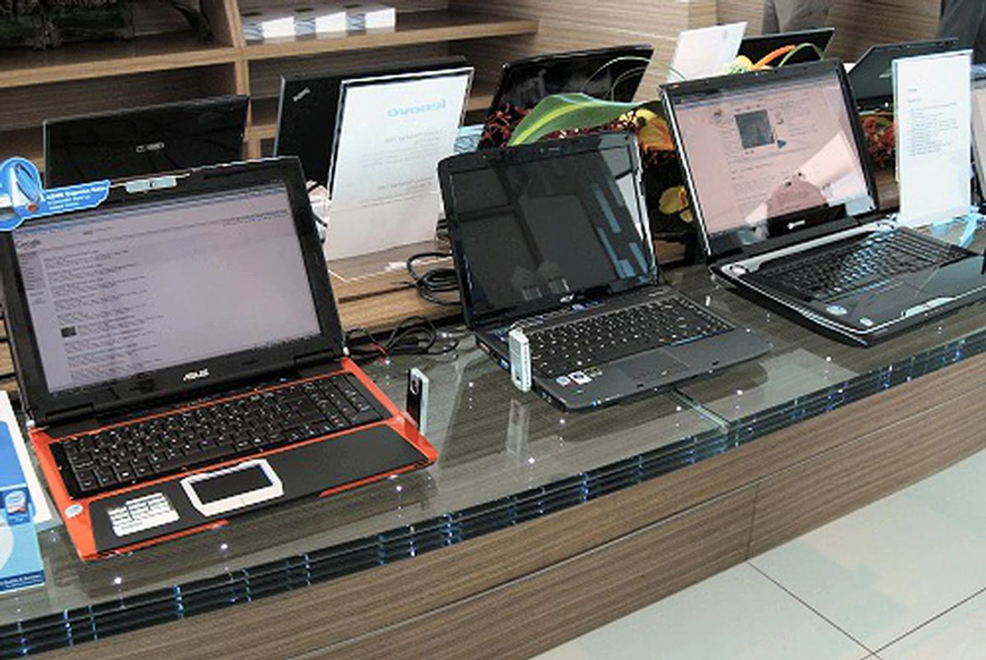 Montevina laptops on display with attached WiMax dongles.