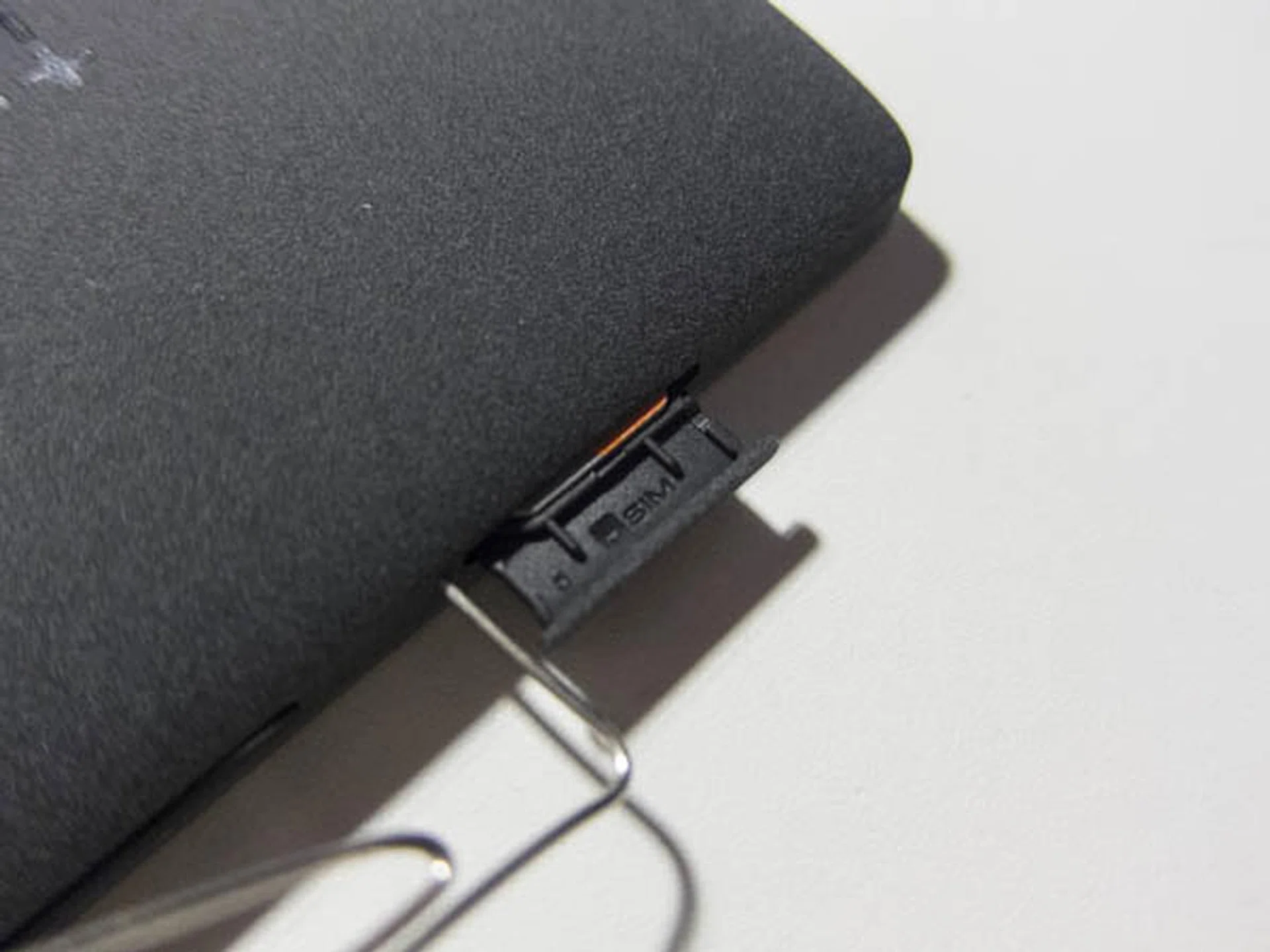 Ejecting the micro-SIM card tray requires meddling with a pin.