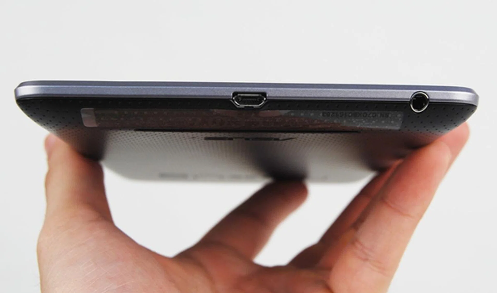 Compared to the proprietary connectors found on ASUS and Samsung tablets, the choice to use microUSB port will bring convenience to Nexus 7 users as they can use any microUSB cable to charge and transfer files. On the far right is the 3.5mm audio output jack.