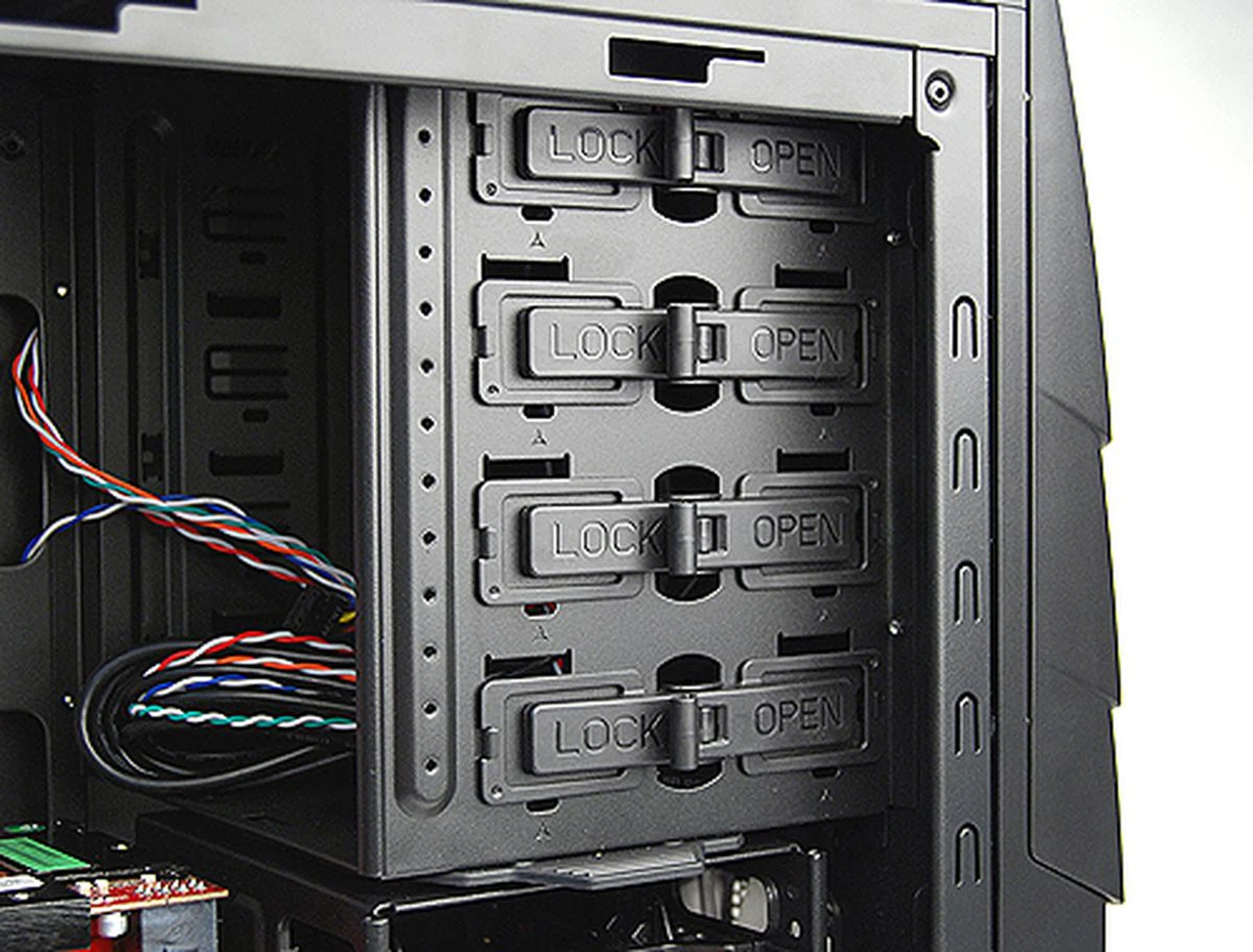 Installing optical drives is dead simple. Just slot them into the drive bay and lock them in place using the switch.