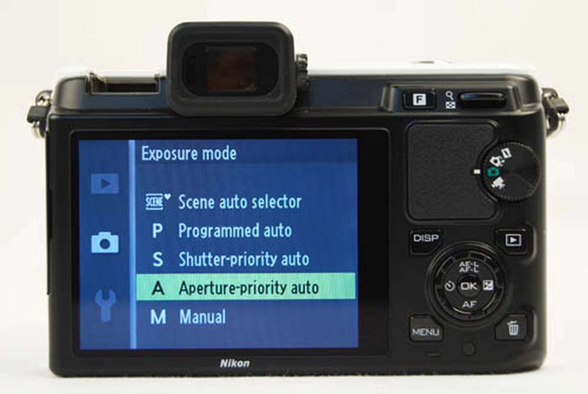 There's no PASM mode selection on the mode dial (even though there's plenty of empty space to put it). Instead, you toggle into the menu to change the exposure mode.