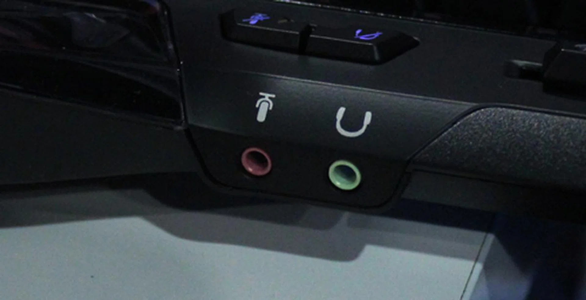 You can plug in your headset and microphone combo directly to the keyboard via the 3.5mm ports.