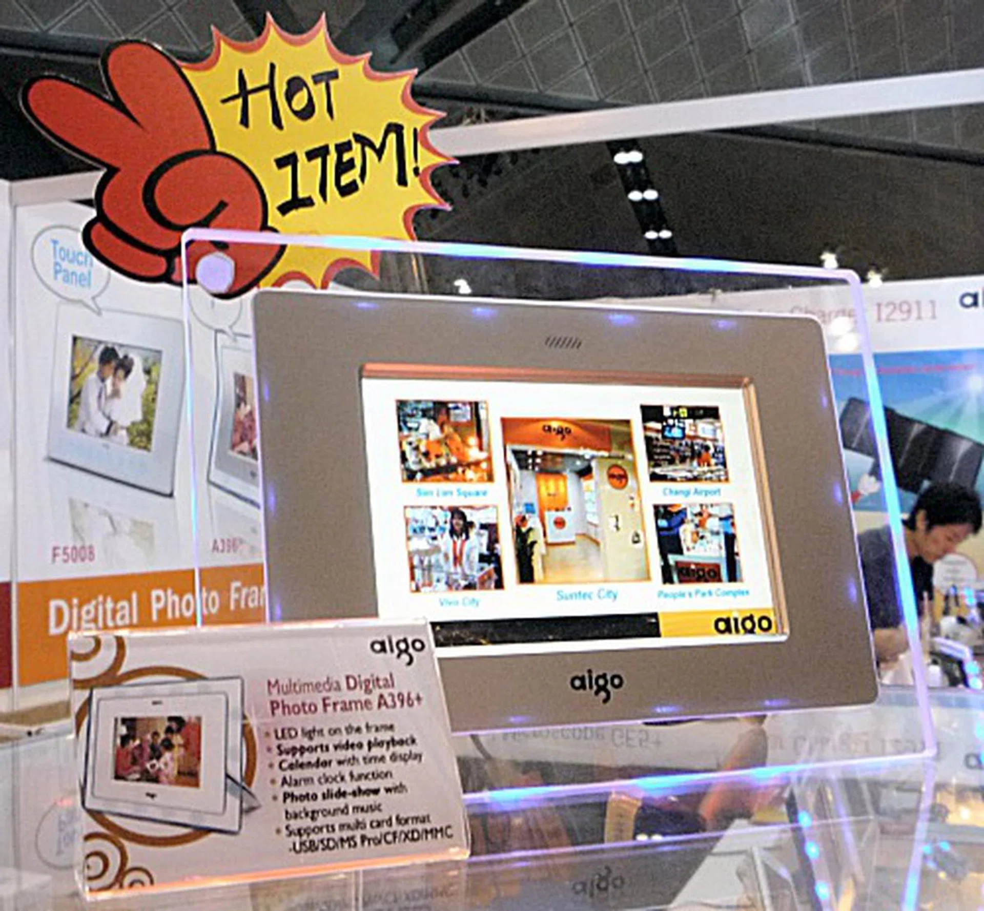  Digital photo frames are all the rage at the moment, and Aigo's A396+ comes with LED lights on the frame and speakers to play background music, remains a hot-selling item since the last COMEX 2007.  