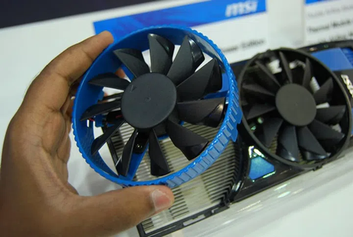 The additional cooling fan is fitted with the blue mounting bracket.