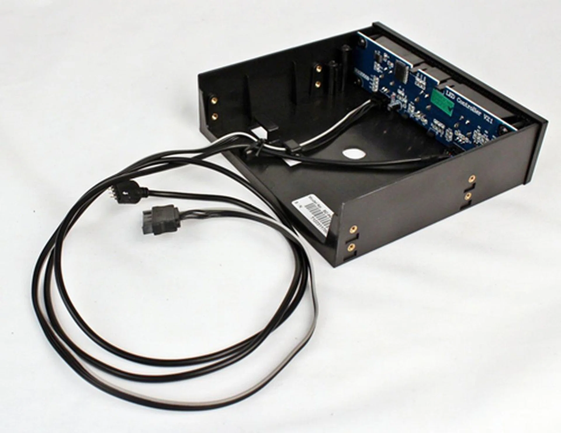 There are two cables that extend from the rear of the controller. One of them terminates in a SATA power connector header that will draw power from the system's PSU. The other cable will connect to the bundled sleeved LED strip.