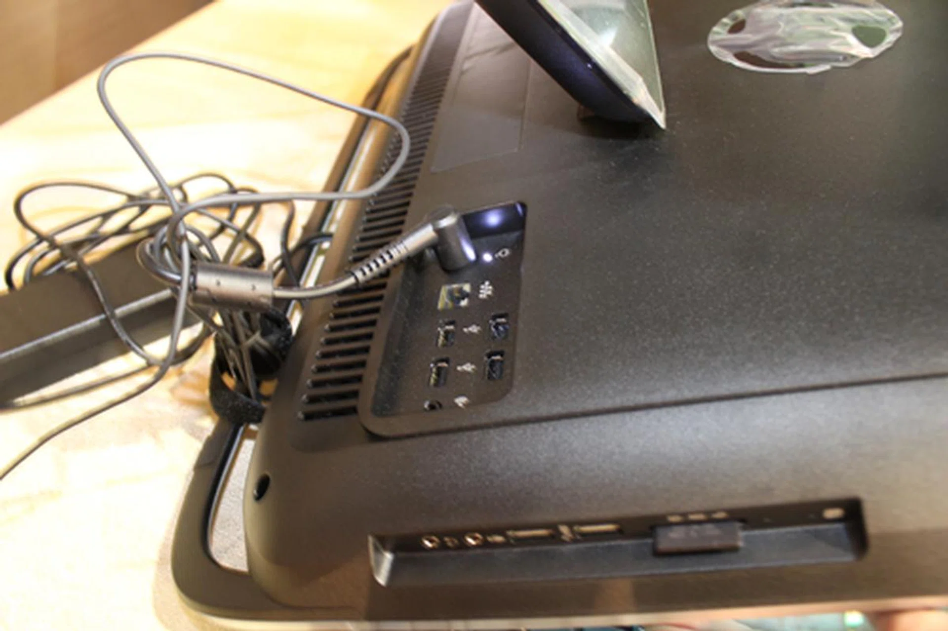 AIOs aren't just good for saving space, they also cut down on the number of unsightly cables you have in your home. It may look messy now, but the machine requires only one power cable. 