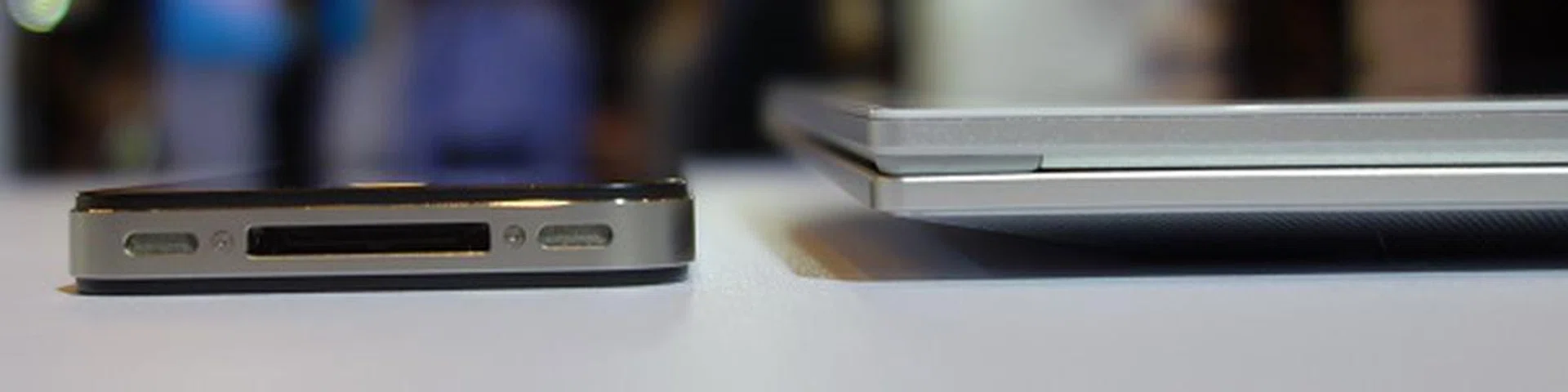 In tablet mode, the Duo is remarkably thin at just under 20mm thick. Here's the Duo 13 (right), with an iPhone 4S (left) for comparison.