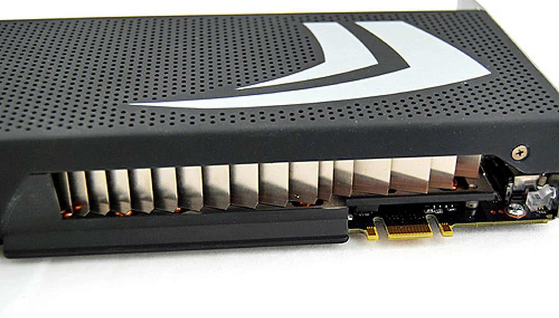 As you'll see later from our temperature reporting, the heatsink might not look like much, but it works. Also note the SLI connector, which makes Quad-SLI with two GeForce GTX 295 cards possible.