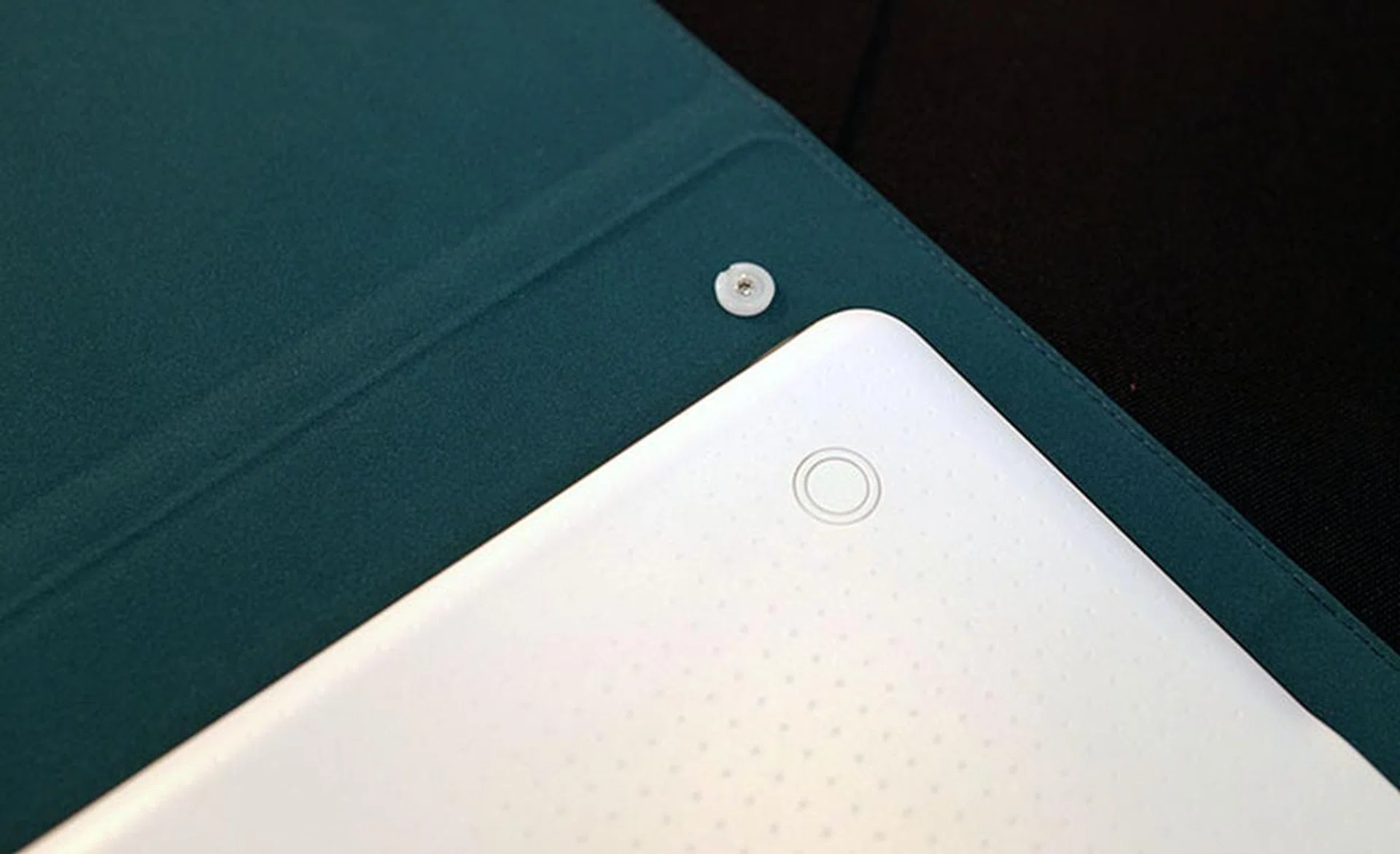 Attaching the Book Cover to the back of the Tab S is like buttoning up a shirt.