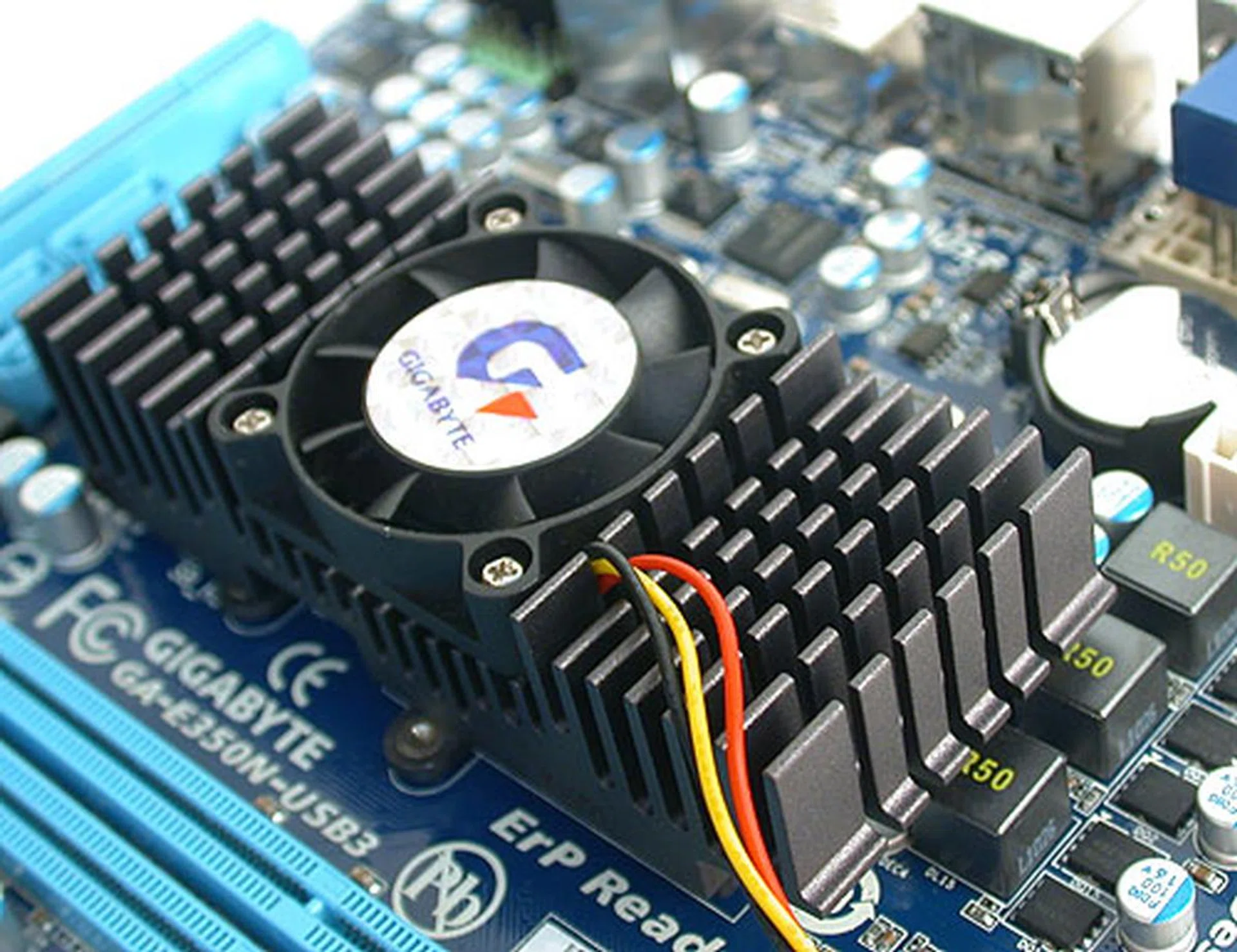 The unified heatsink with cooler on the Gigabyte board cools both the chipset and the APU. It's relatively quiet at its default settings. 
