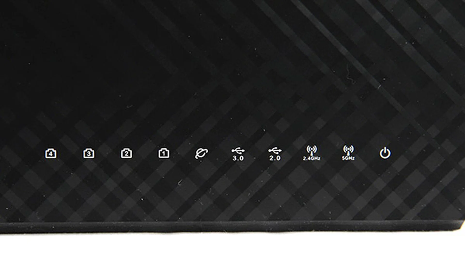 The router has a distinctive checkered, honeycomb pattern that ASUS has been using on its recent routers. Also, it features numerous LED status lights which lets the user know if everything is working as intended.