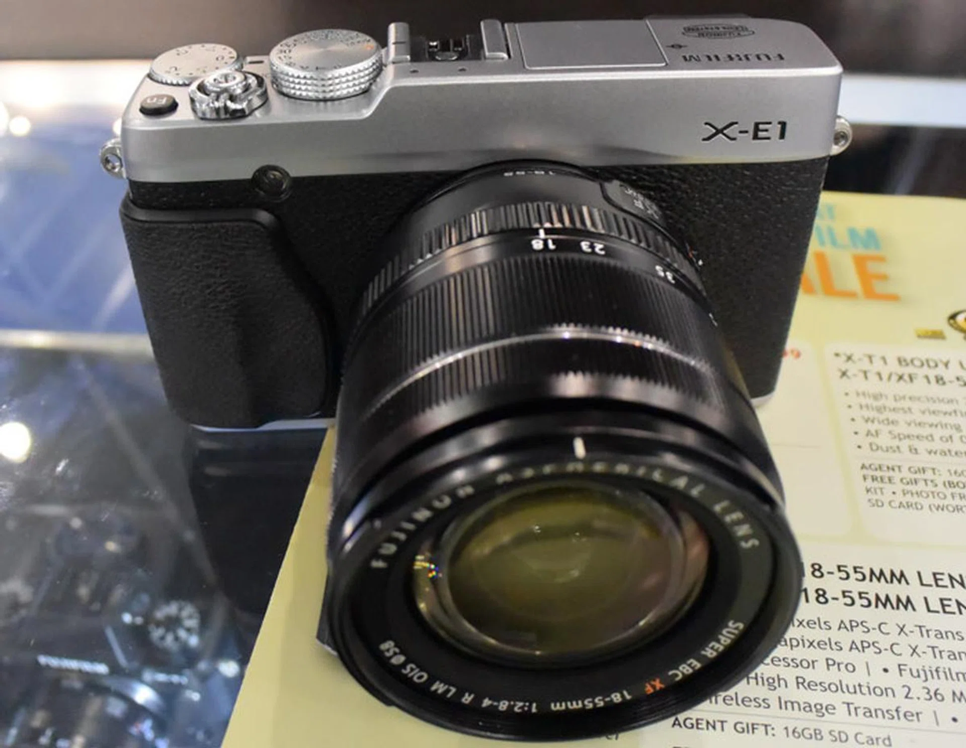 The Fujifilm XE-1 with 18-55mm lens goes for $1,199 after cash back, and features a 16.3MP APS-C X-Trans CMOS sensor. What's nice is you also get the 50-230mm lens (silver) as part of the free gifts, so your basic lens needs will be covered from the start.