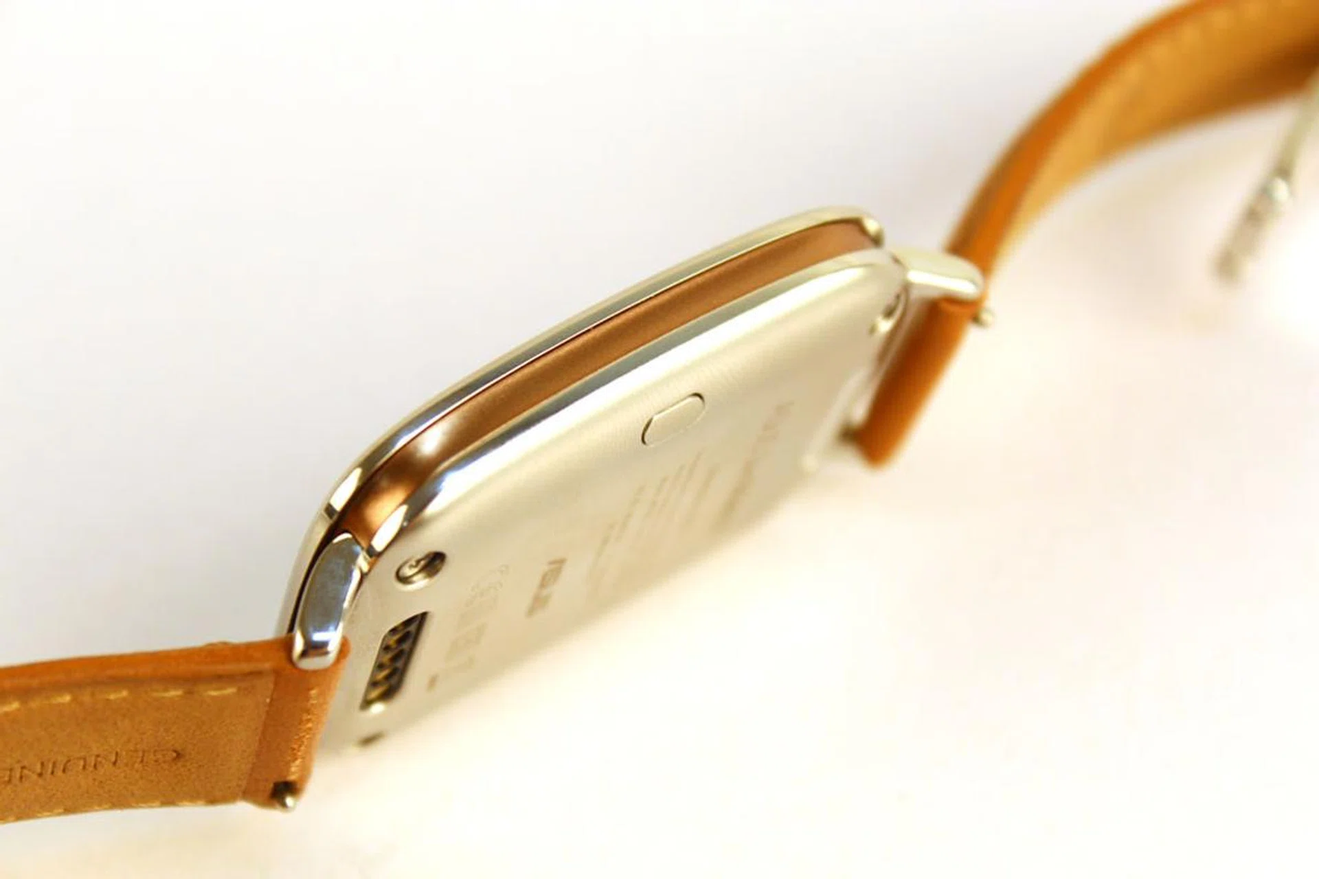 The settings button on the ZenWatch can be found on the underside. 