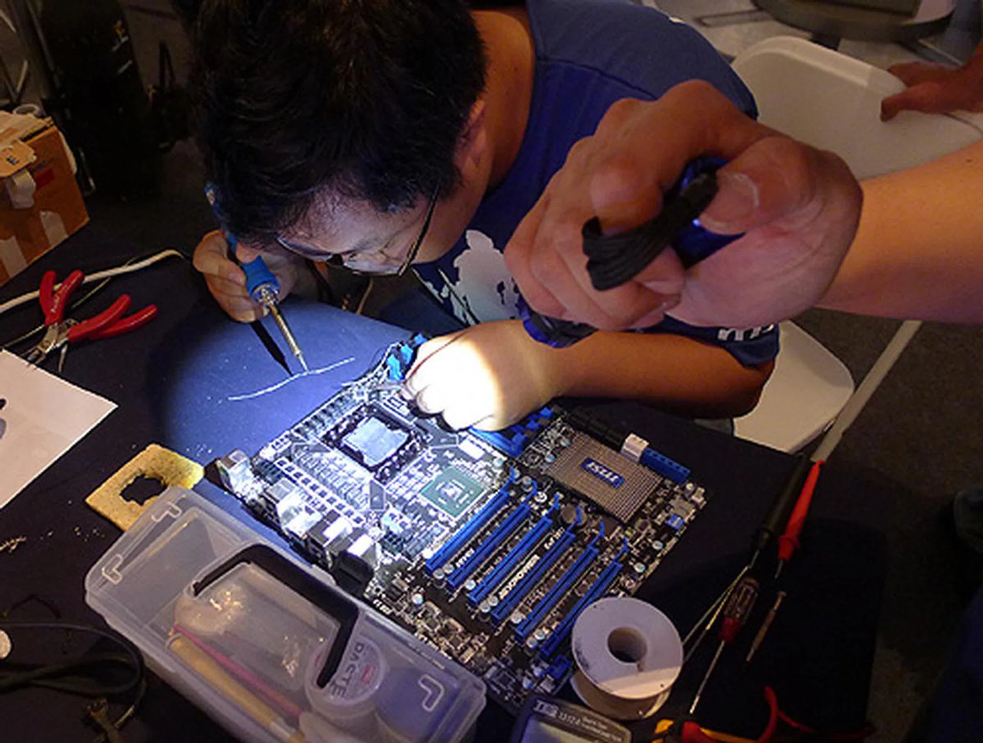 Here is Nightraven from Team Ice Cold Beer of Singapore making modifications to the board.