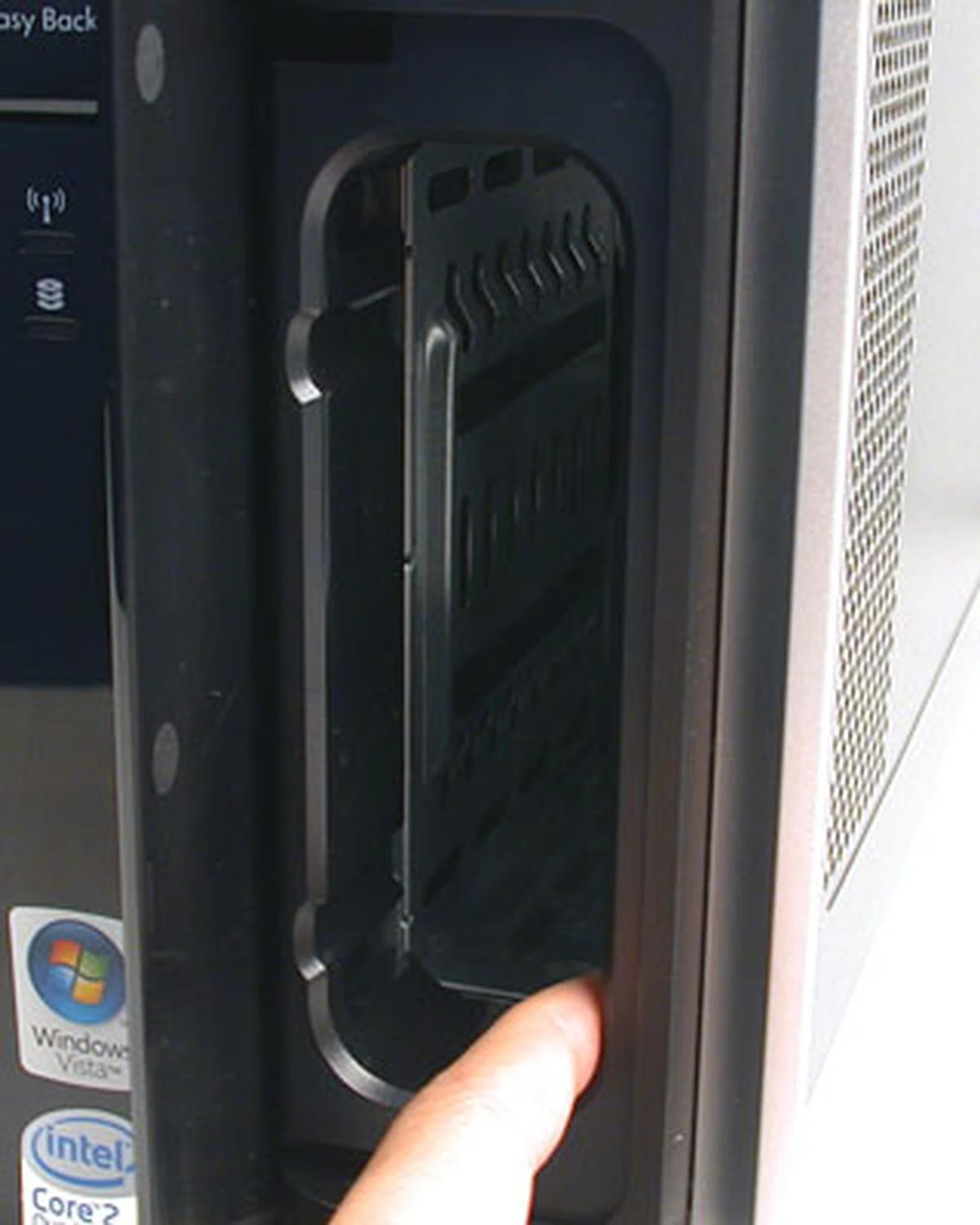 If you have bought into the whole HP ecosystem for your computing needs, you may have the HP Personal/Pocket Media drives. Essentially, these are external hard drives that you can slot into for use in conjunction with the Easy Backup feature. The one shown here is the slot for the larget Personal Media drive. There's another slot for those who have the handier version (Pocket Media drive). For those who don't have either, these two slots would just be a waste of space. 