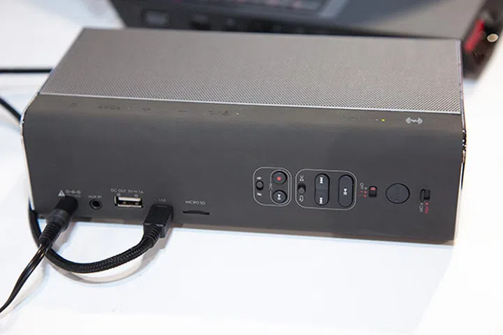 The rear end of the speaker with all the various ports and playback/record buttons.