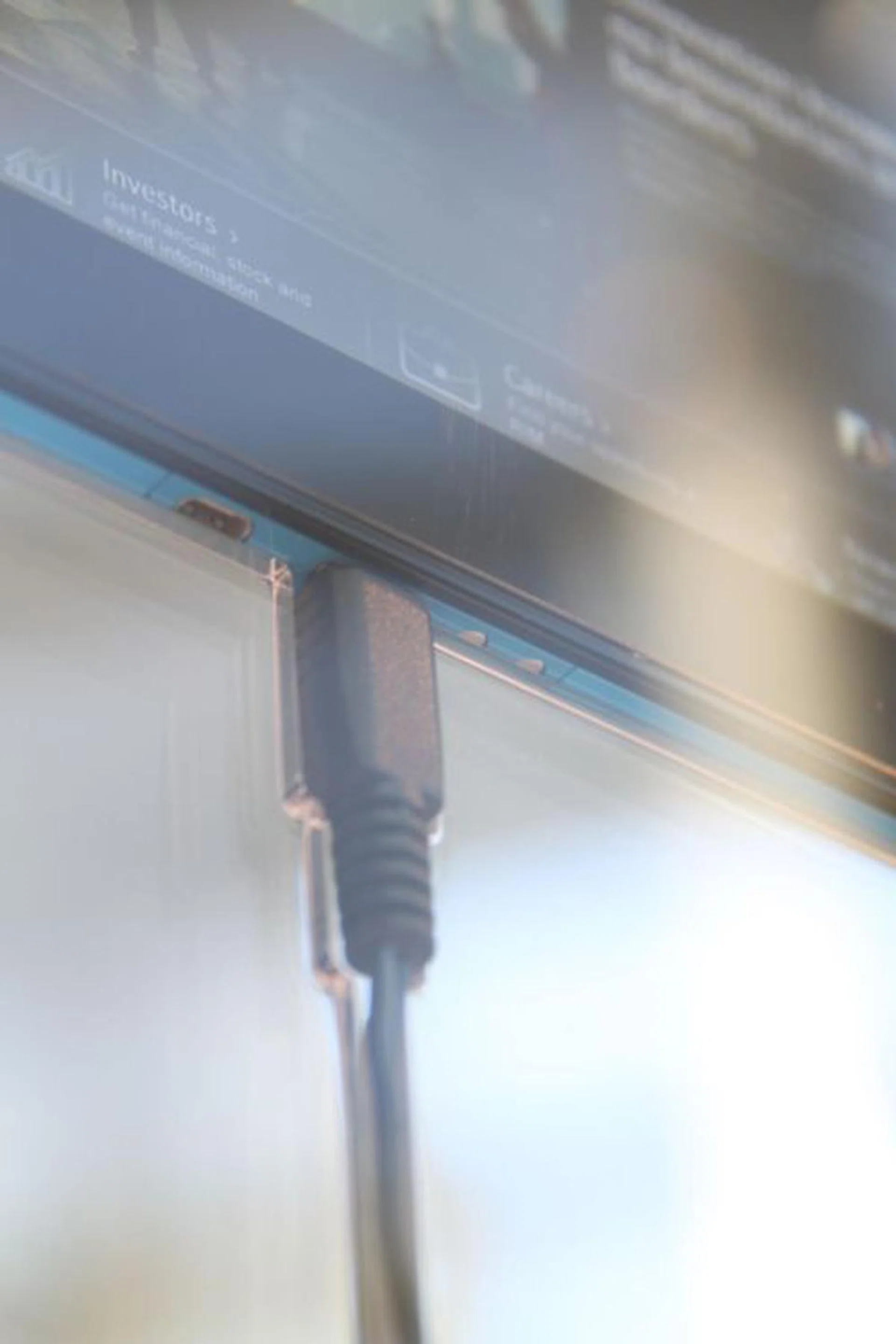 At the bottom of the unit, you'll see the microHDMI, microUSB port and the charging contacts.