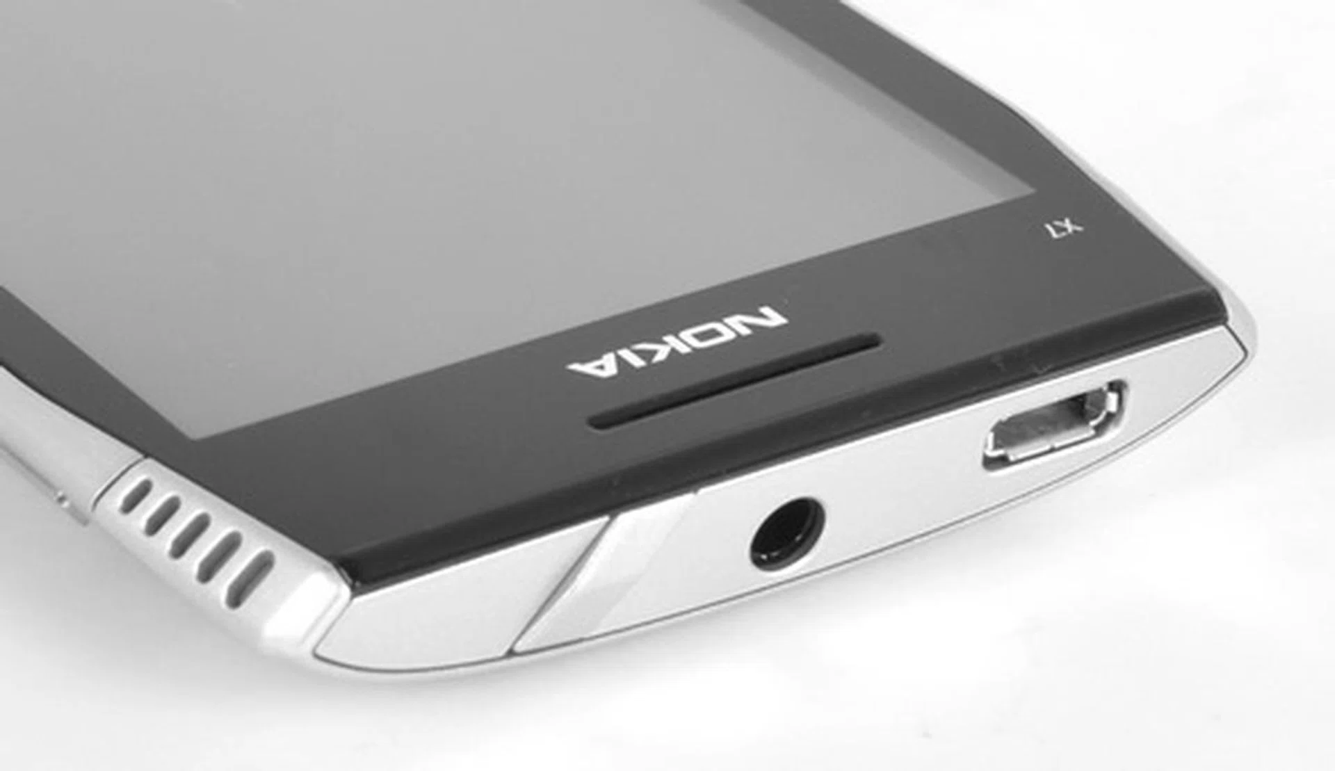 The top section of the phone has the two connectivity ports (micro-USB and 3.5mm headphone jack) and a uniquely shaped lock button.