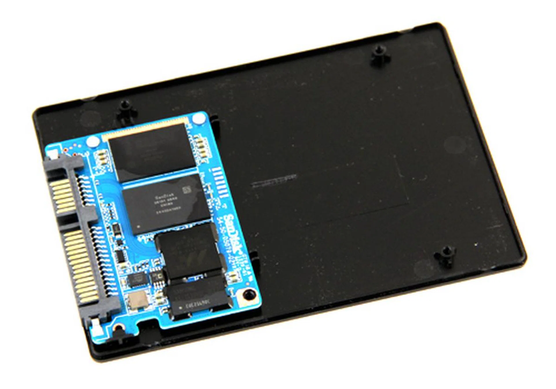 Peeling away the cover, we can see the innards of the drive. As you can see, it's really basic. There's the Marvell SS889175 controller, a 128MB DRAM chip, and four 64GB SanDisk MLC NAND chips (two on each side).