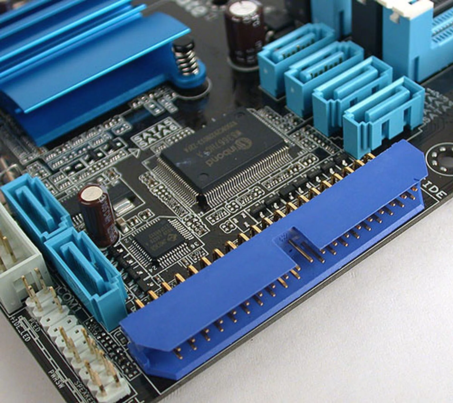 This arrangement of the six SATA ports may seem uncommon but ASUS has a reason for this layout. Doing so means those ports will not be in the way of a long graphics card installed in the PCIe 2.0 x16 slot. An IDE connector is also present thanks to a JMicron controller included by ASUS.