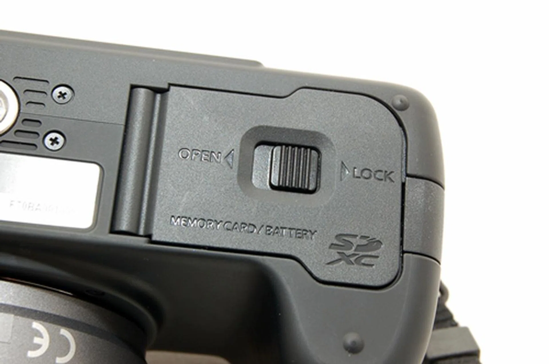 A safety lock is seen here for the battery and SDXC card slot compartments.