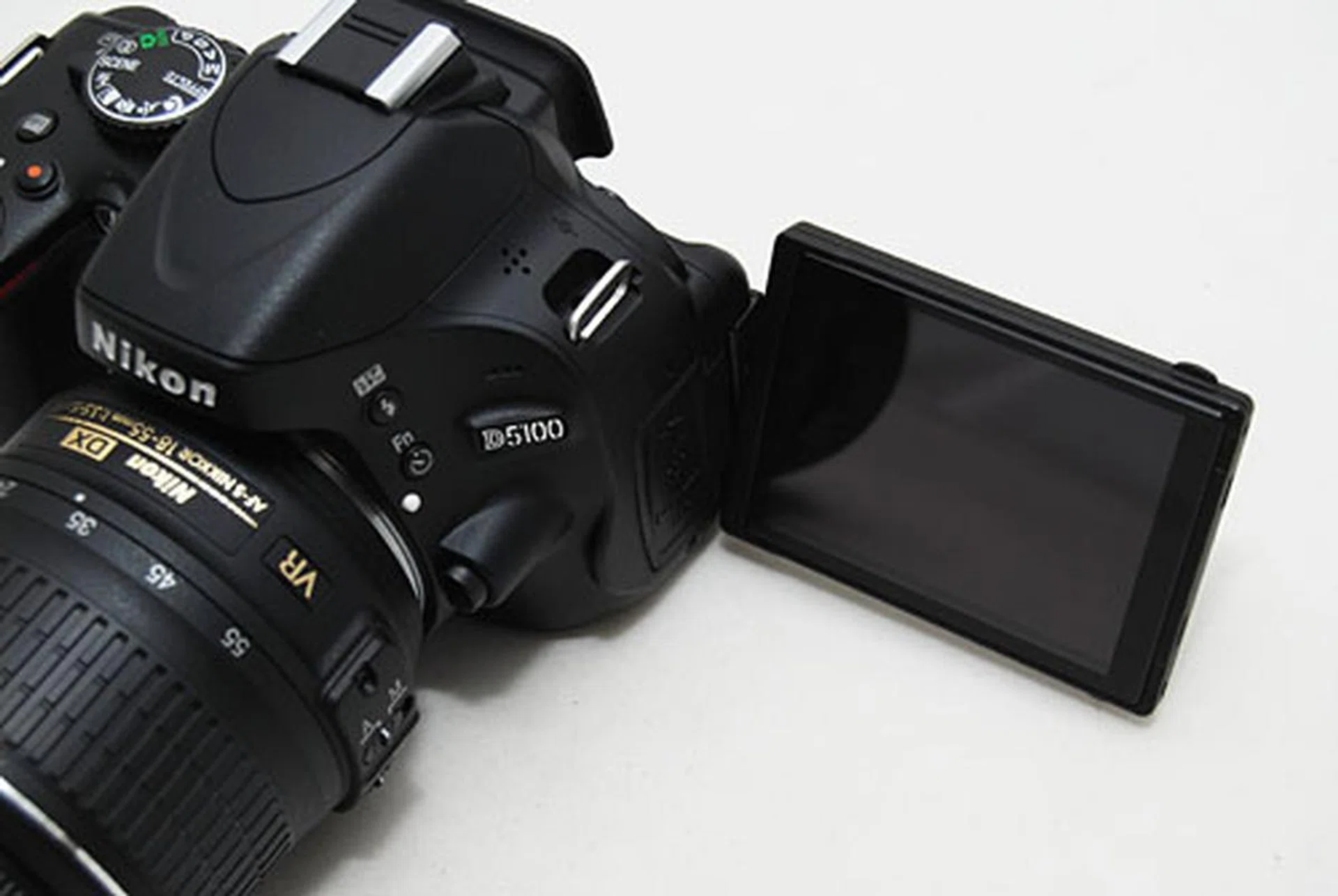 Unlike the D5000's LCD screen which pivoted from the bottom of the camera, the D5100's LCD screen pivots from the side.