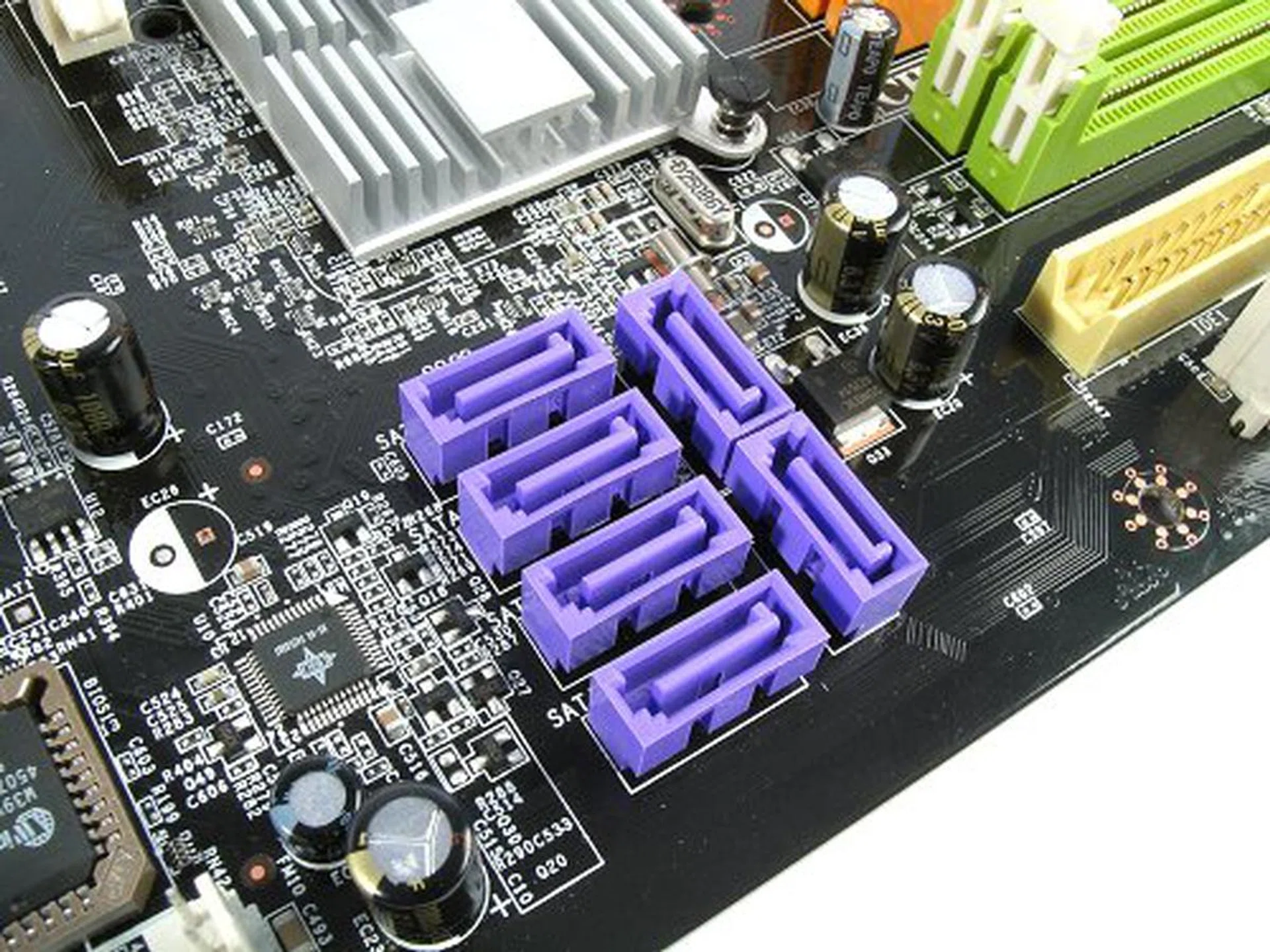 One less IDE port, but the six SATA connectors you see here are all controlled by the chipset, full SATA 3.0Gbps, NCQ, MediaShield and now with RAID 5 even. 