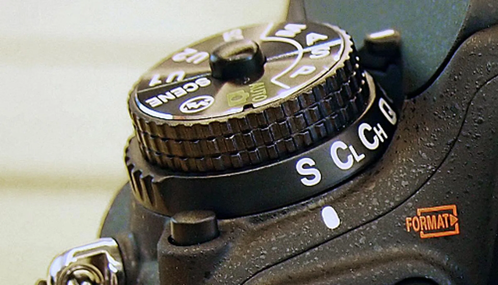 The button to release the mode dial now provides more tactile feedback.