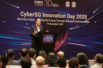 Senior Minister of State for Digital Development and Information Tan Kiat How delivering his speech.