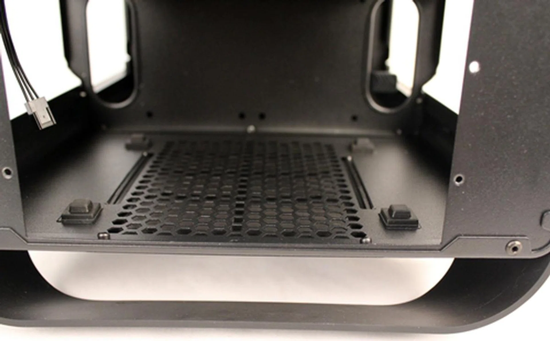 There are four rubber standoffs to give some breathing space for the PSU from the bottom air intake vents.