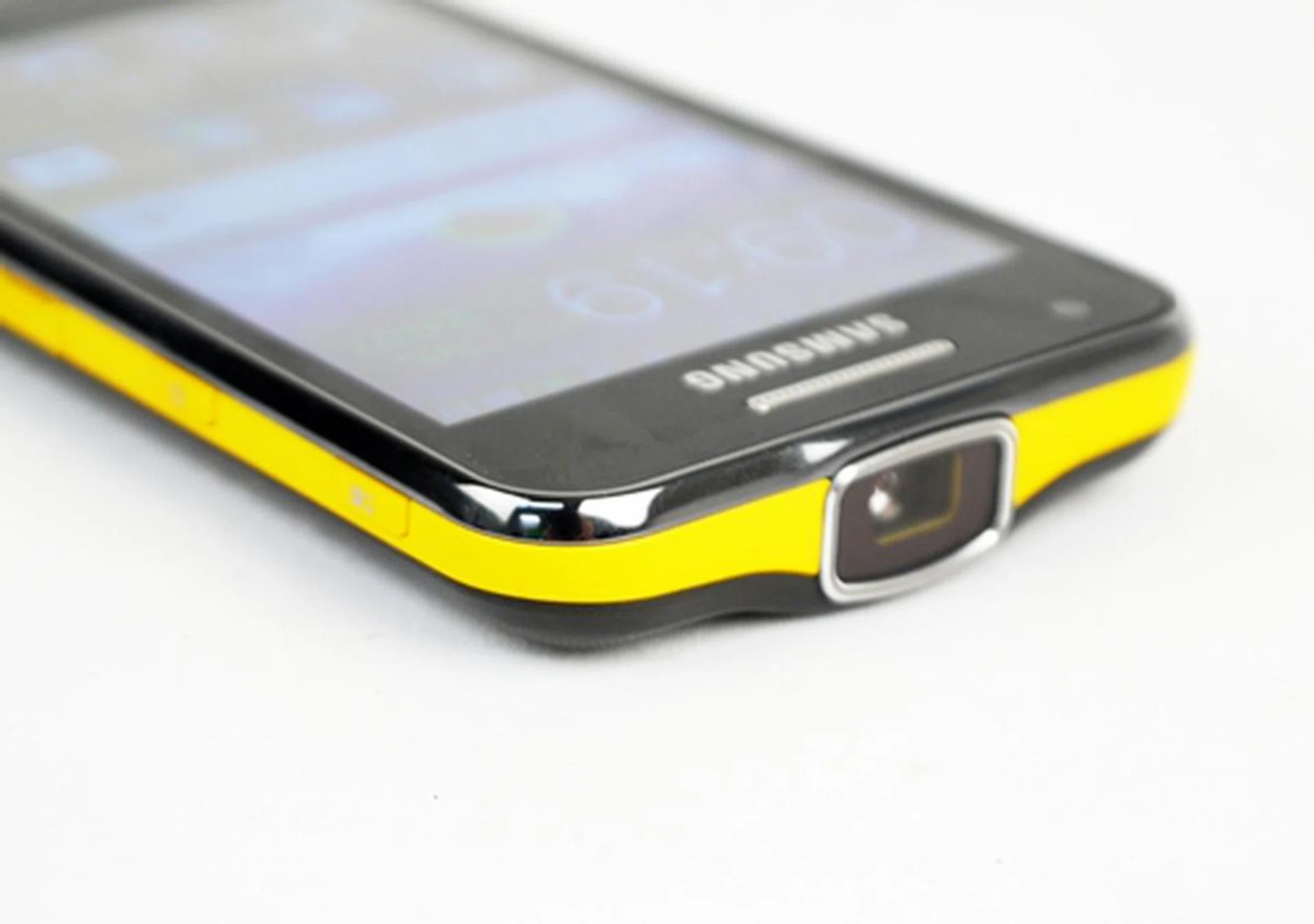 The splash of yellow does add a little life to an otherwise serious "business" smartphone. Note the huge projector lens on the top.
