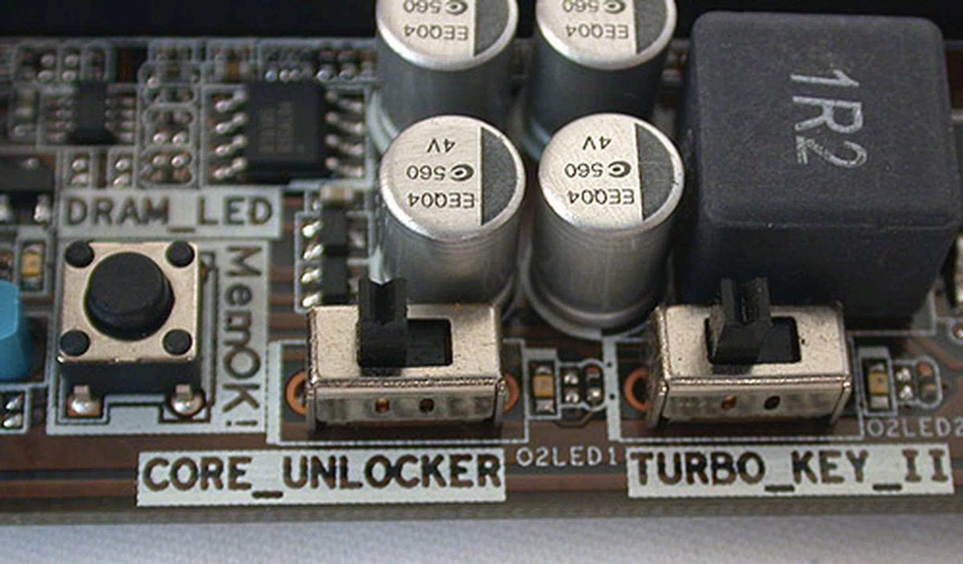 Here are the switches to toggle Core Unlocker, Turbo Key II and MemOK!. All three features are found on ASUS' other boards, like the Crosshair IV Formula. Given the presence of such onboard buttons, we were almost surprised that there were no power/reset buttons onboard and resetting the CMOS relied on a jumper instead of a button.