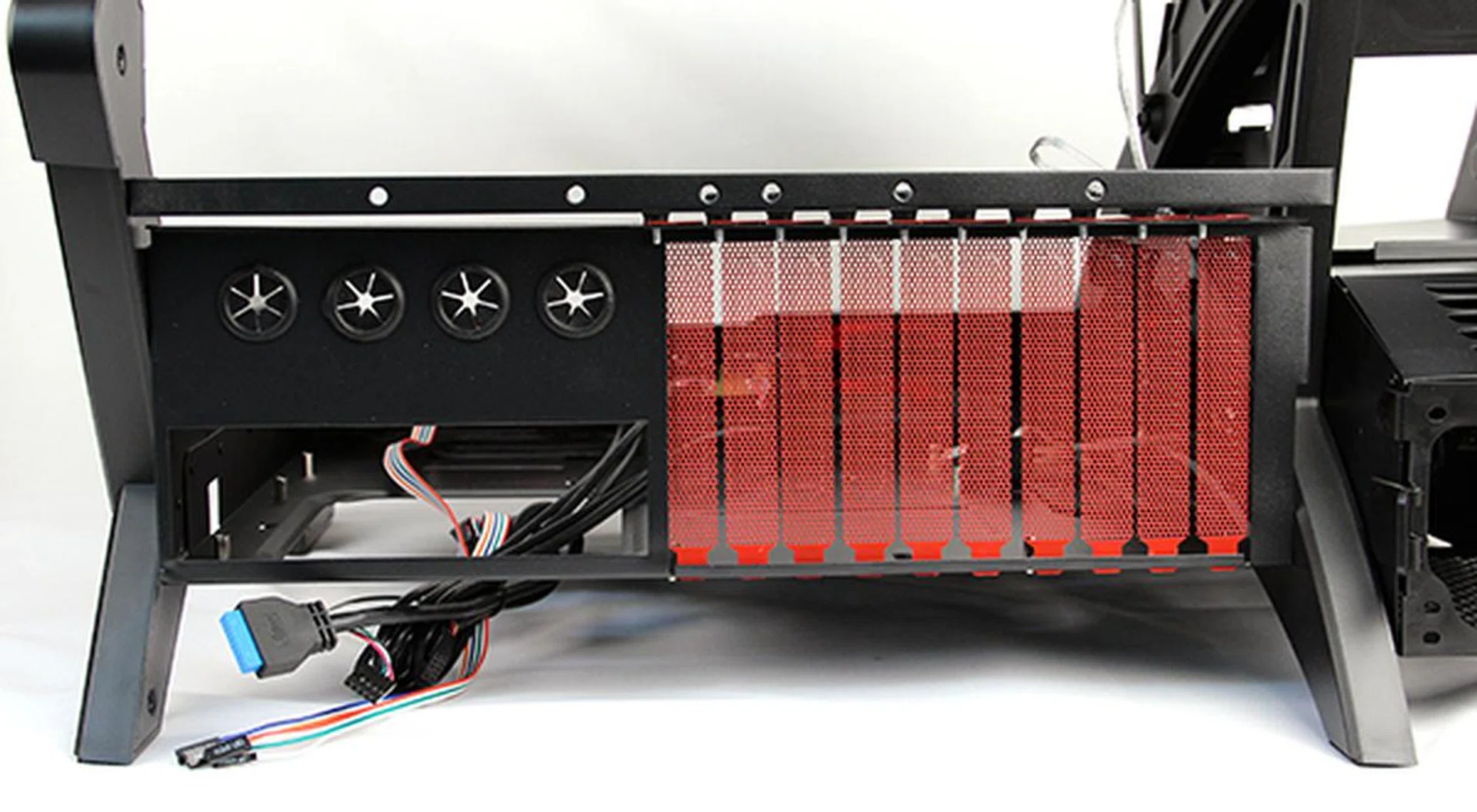 There's ten expansion slots (great for E-ATX form factor motherboards) and four rubber grommets. The bar above with drilled holes is for installing radiators for liquid-cooling setups.