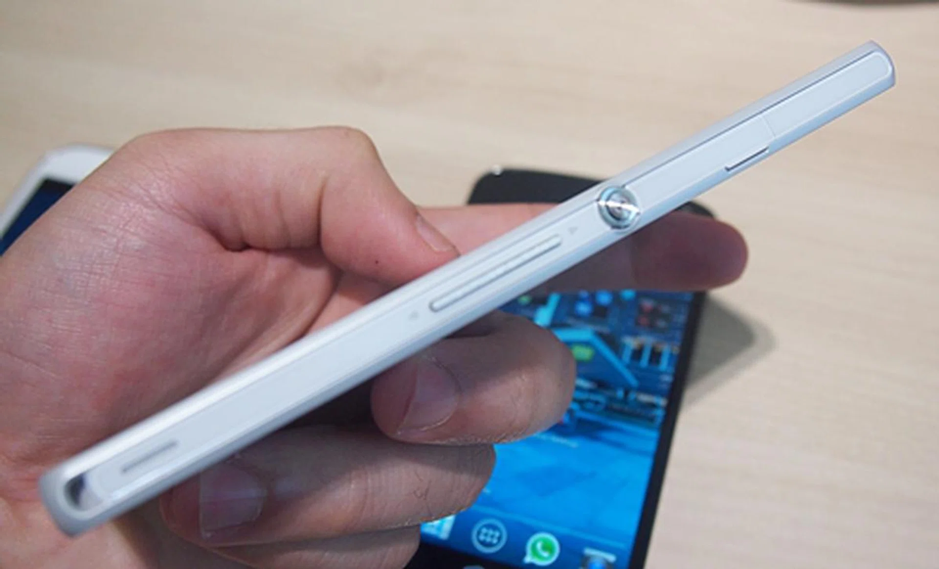The volume controls provide decent tactile feedback. To the right of the Power button is the microSIM card slot, which is also protected by a tight plastic cap.