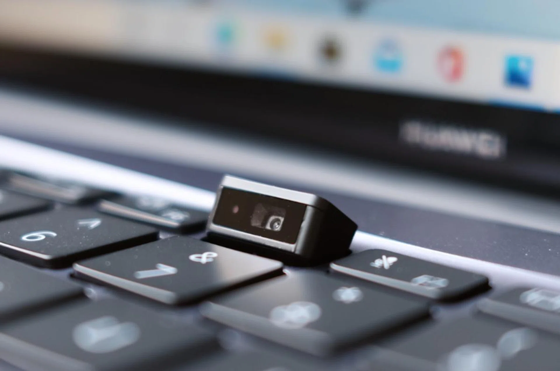 The webcam is hidden underneath one of the keys in the function row.