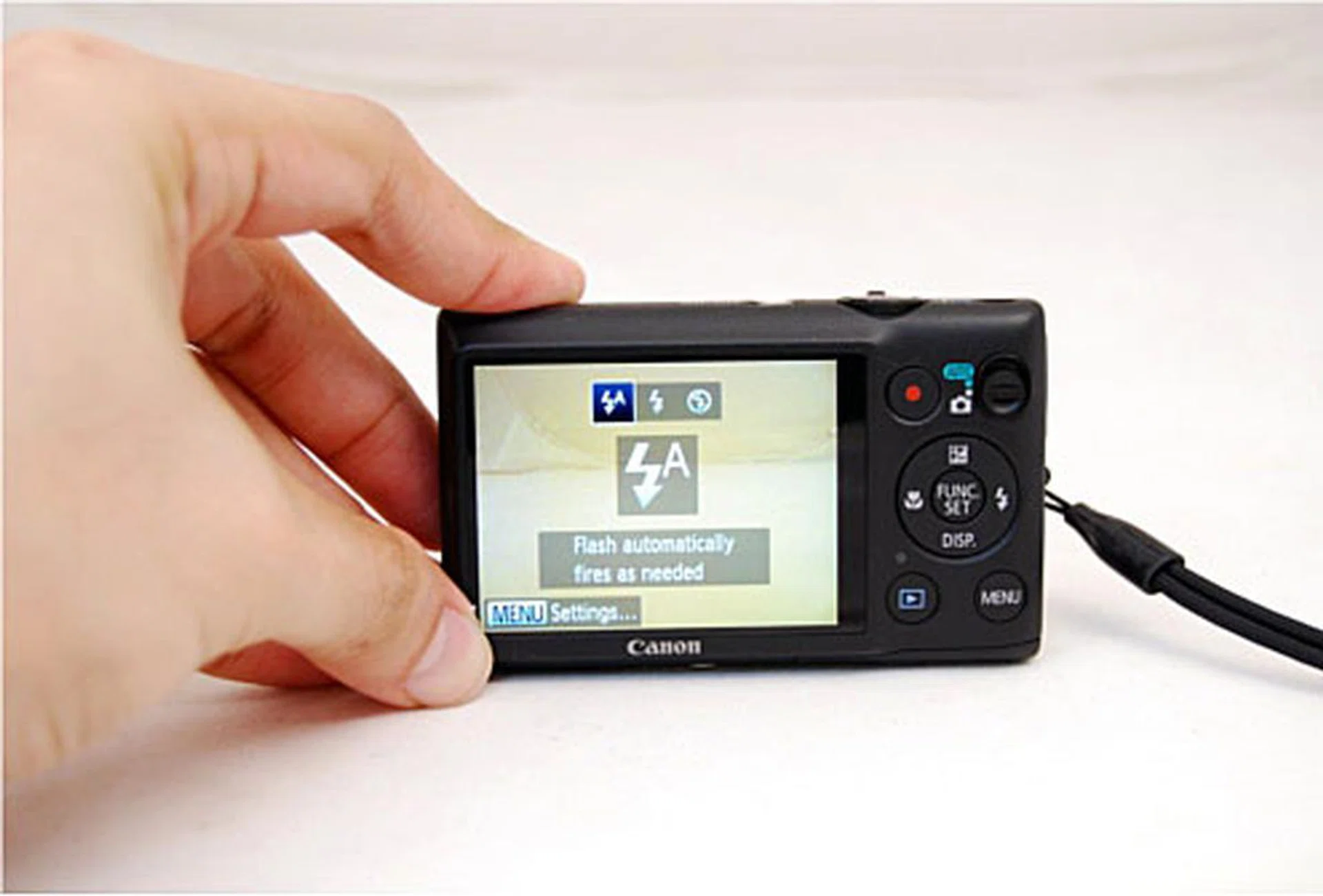 Be careful of blocking the flash by accident as the 220 HS is pretty dainty as seen here with our man-hands.