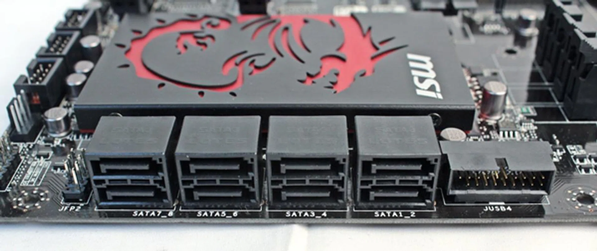 The leftmost stack of SATA connectors are connected to the ASMedia ASM1061 controller, while the rest are provided by the chipset. The system panel connector is to the left of the entire stack of SATA connectors and the USB 3.0 expansion connector is to its right.