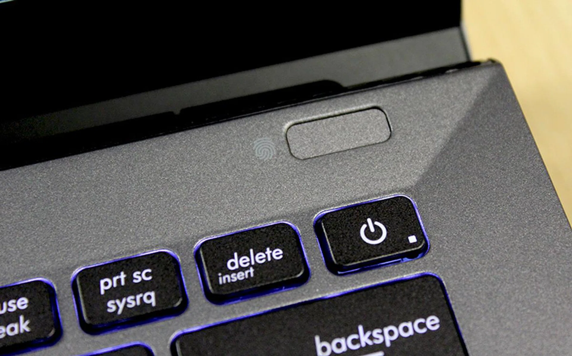 There is a fingerprint scanner to the top right of the keyboard.