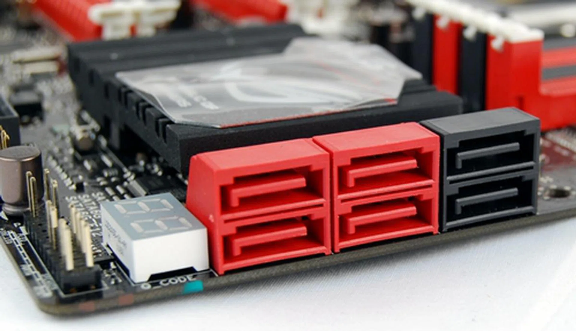 All the red SATA ports are 6Gbps compliant but only the middle set is powered by the Intel chipset. The red set on the far left are powered by an ASMedia ASM1061 controller onboard. The black ports on the right are SATA 3Gbps connectors that are controlled by the Intel chipset