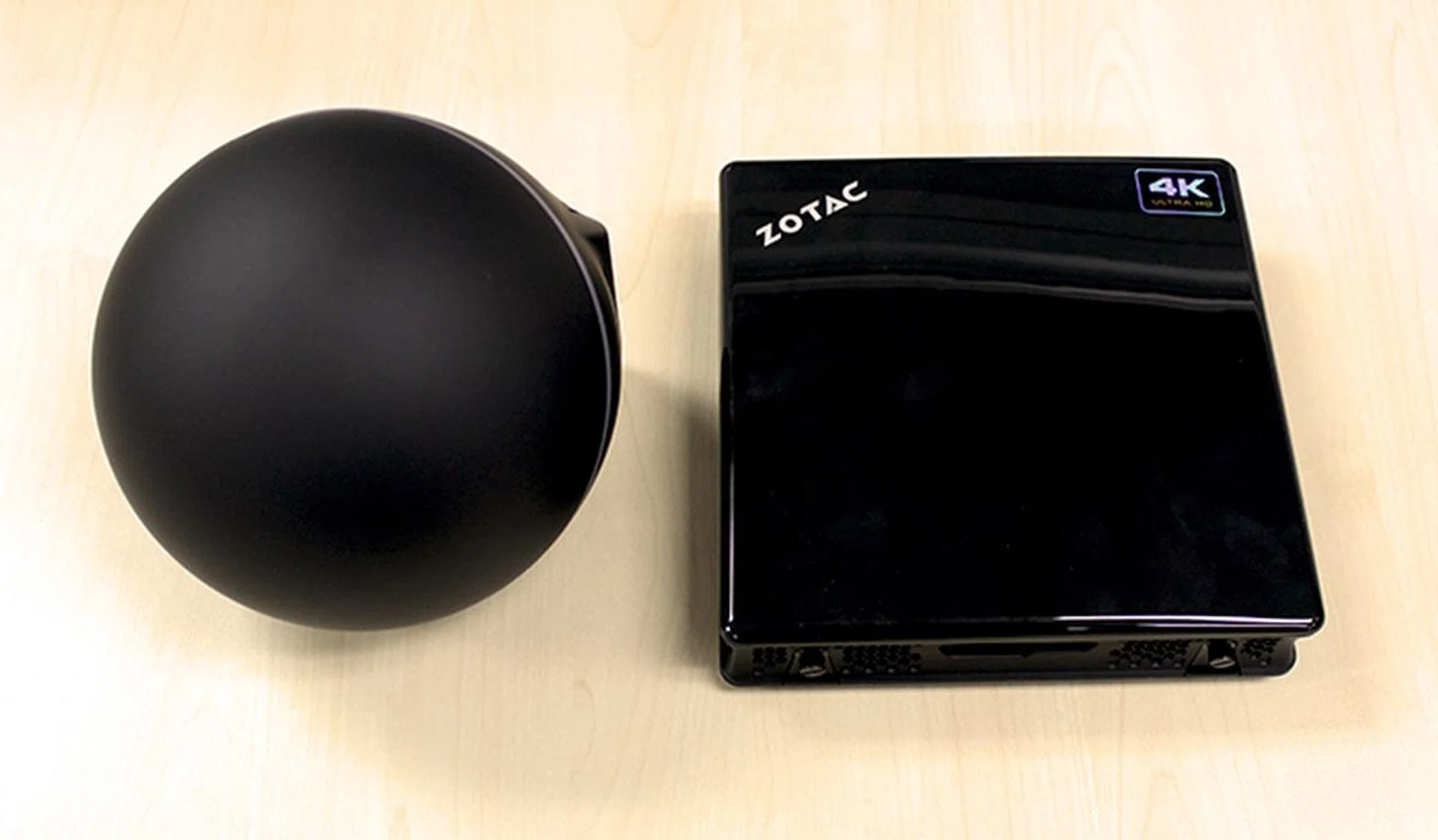 Here is the ZBOX Sphere OI520 next to the ZBOX IQ01, both are equally compact, though the Sphere does take up more space by virtue of its spherical design.