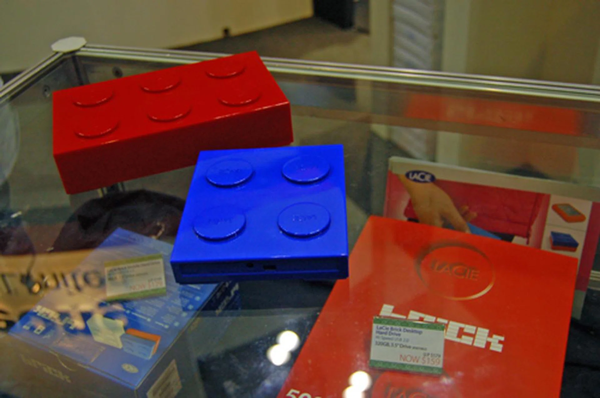  The red LaCie 320GB brick desktop hard drive and the blue 80GB brick mobile hard drive are going for $159 and $129 respectively. Reminiscing the Lego days.  