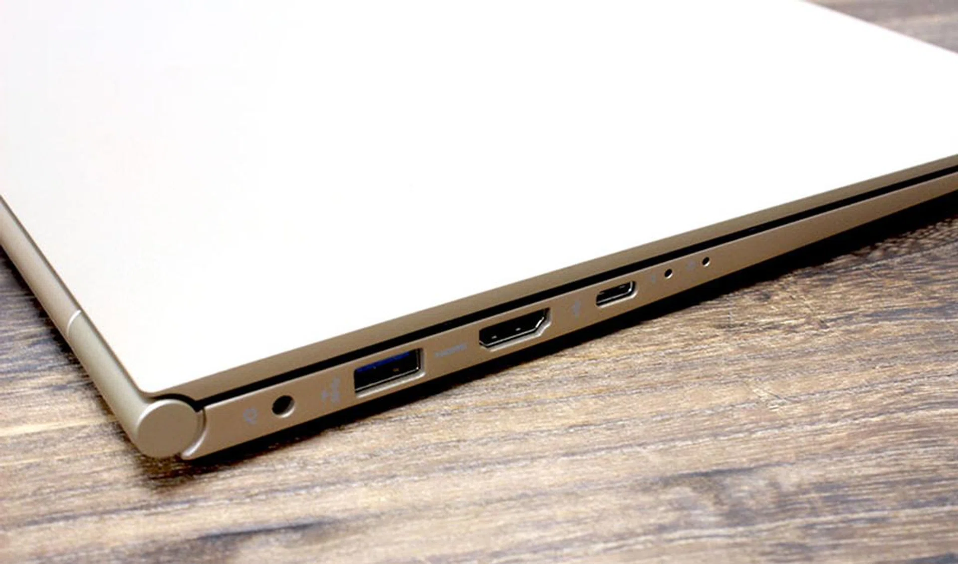 On the left is a USB 3.0 port, a full-size HDMI port, and a USB Type-C port. The two smaller ones on the right are for the internal microphone.